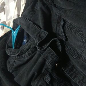 Faded black denim jacket .